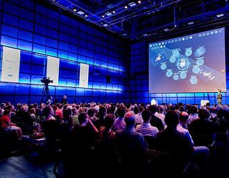 Large event venue with stage, LED video panels, and crowd enjoying WhiteHouse DJ entertainment